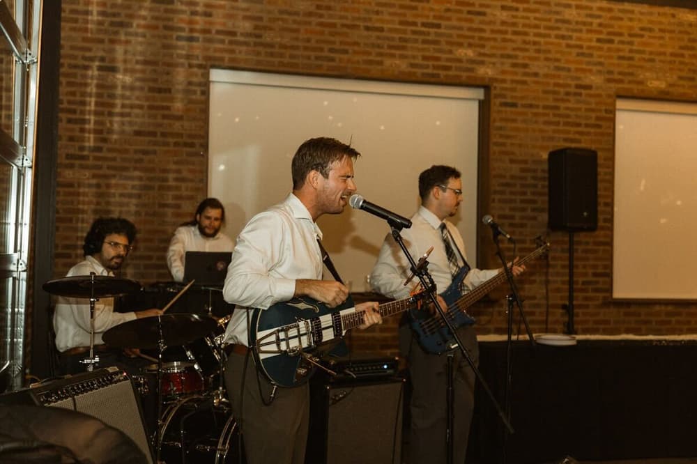 Monorail Sound live wedding band performing at a brick-walled Cincinnati venue