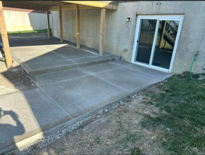 Finished concrete patio under a raised deck in Lebanon, Ohio