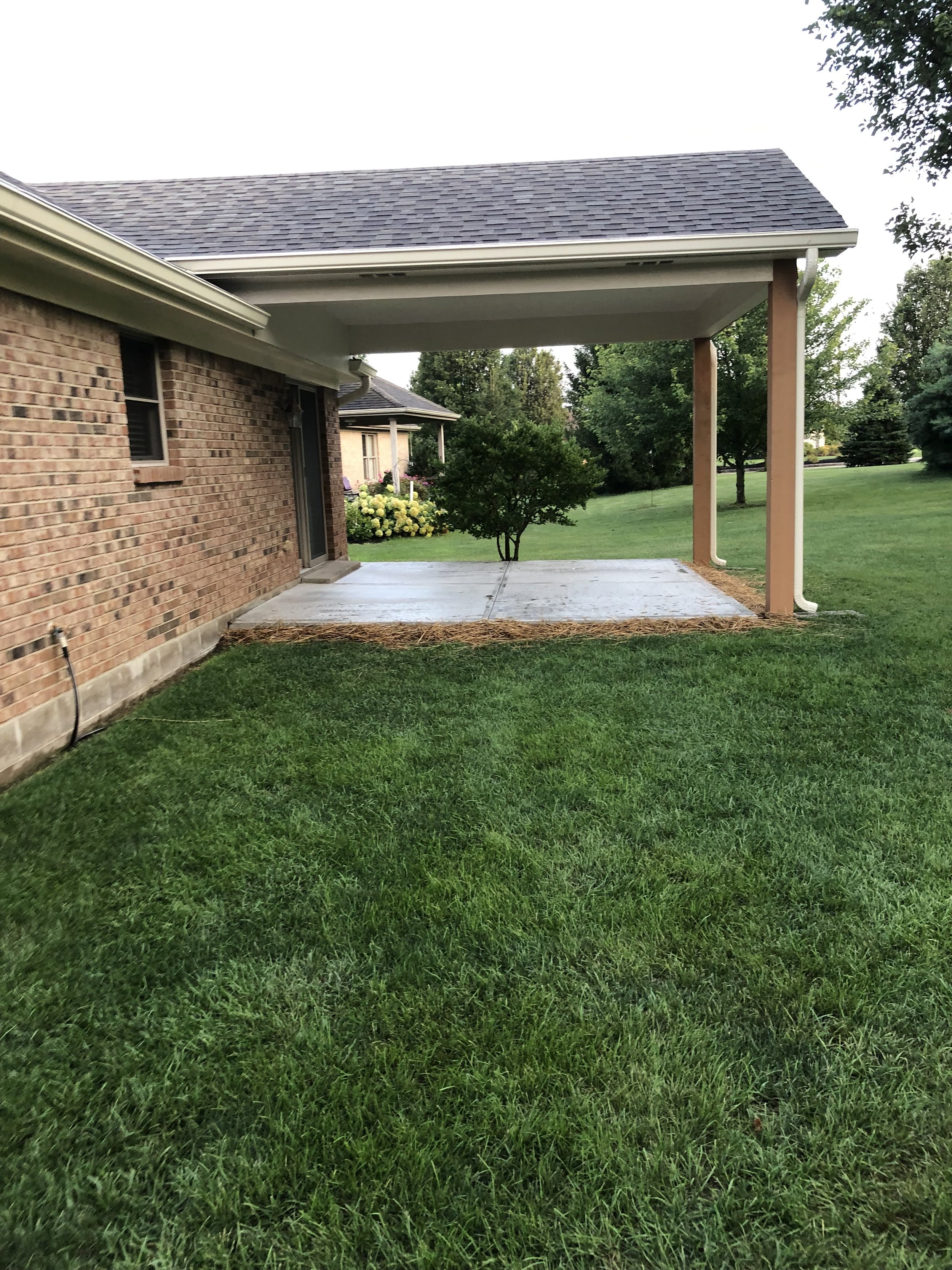 Side view of the finished patio cover in Mason, Ohio showing roofline tie-in