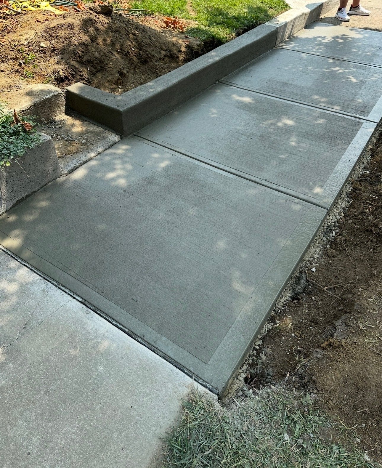Level, broom-finished replacement sidewalk in Warren County, Ohio