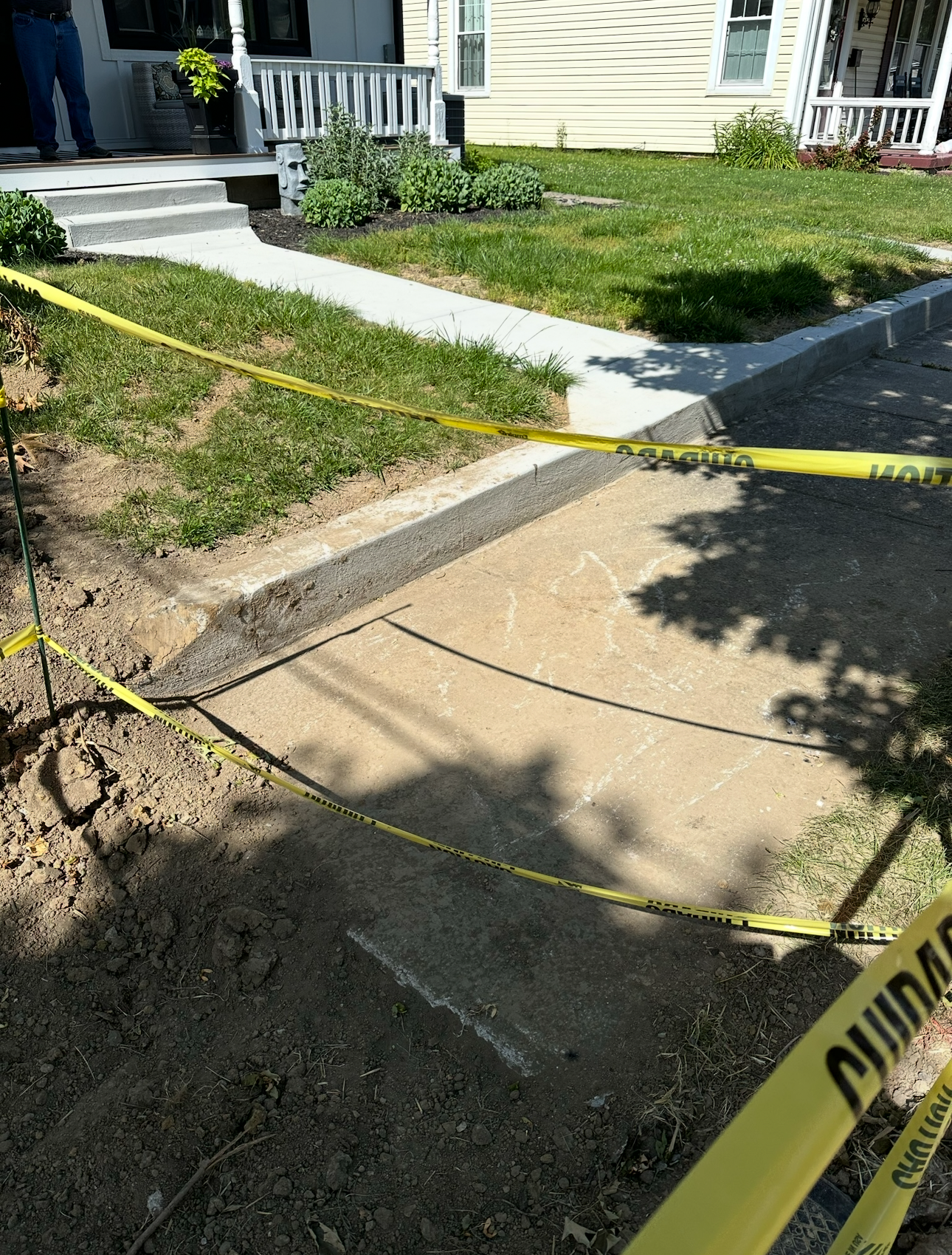 Heaved and cracked sidewalk sections before replacement in Warren County, Ohio