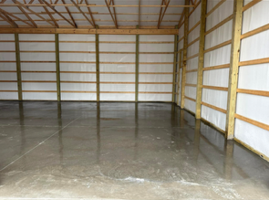 Smooth machine-finished concrete floor inside a pole barn in Springboro, Ohio