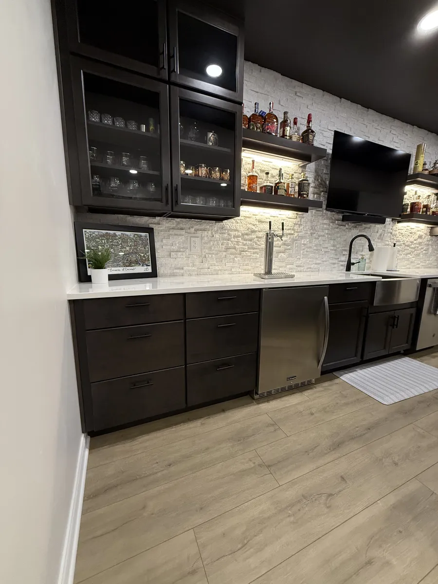 Stacked Stone Bar with Black Cabinets