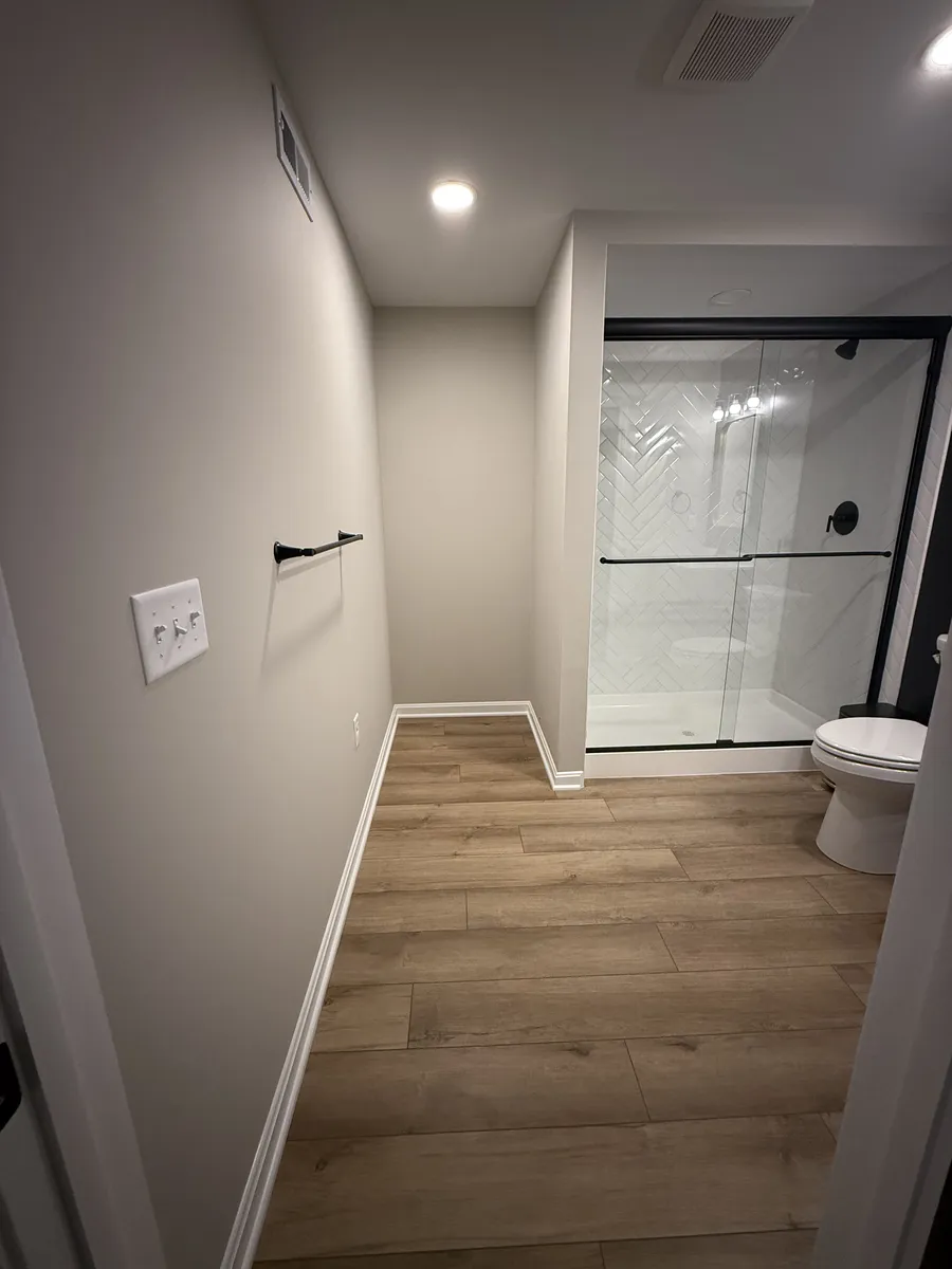 Herringbone Shower with Floating Vanity