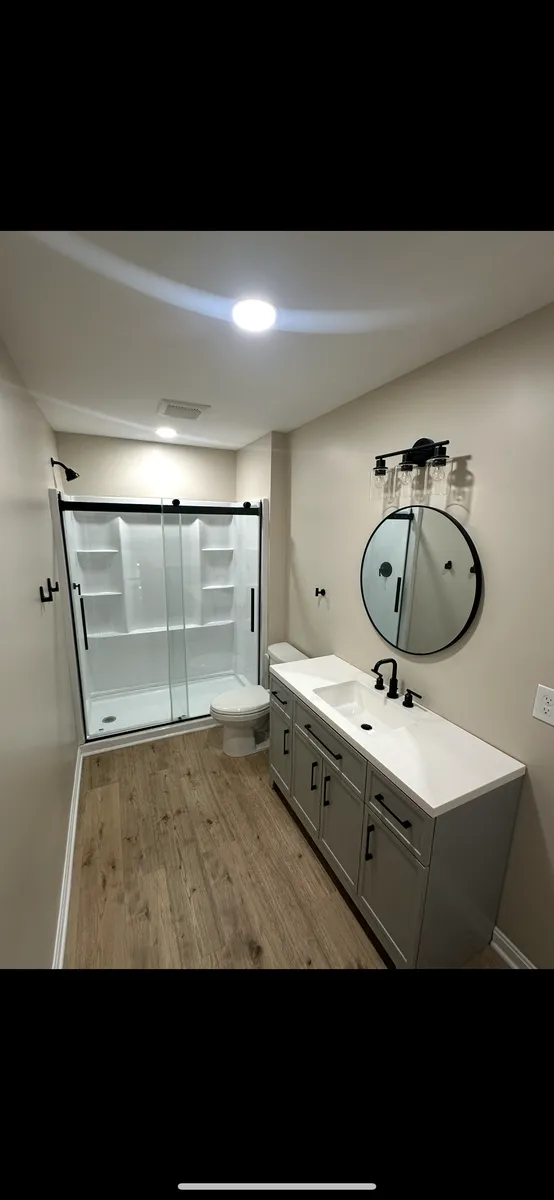 Basement Bath with Round Mirror