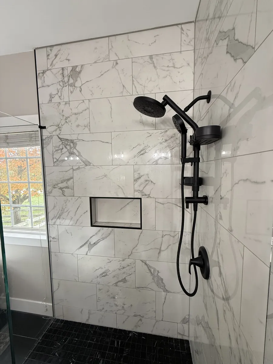 Marble Shower with Black Fixtures
