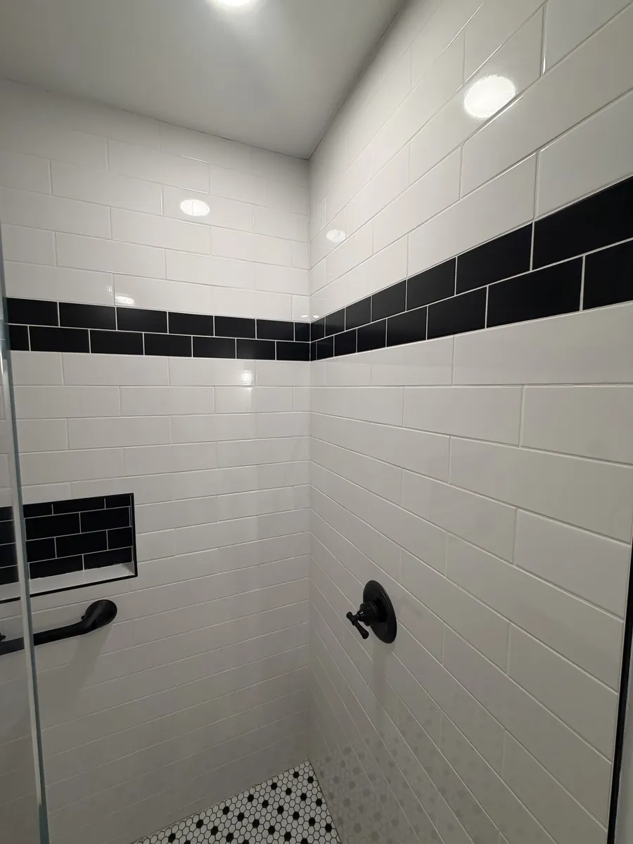 Subway Tile Shower with Black Inlay