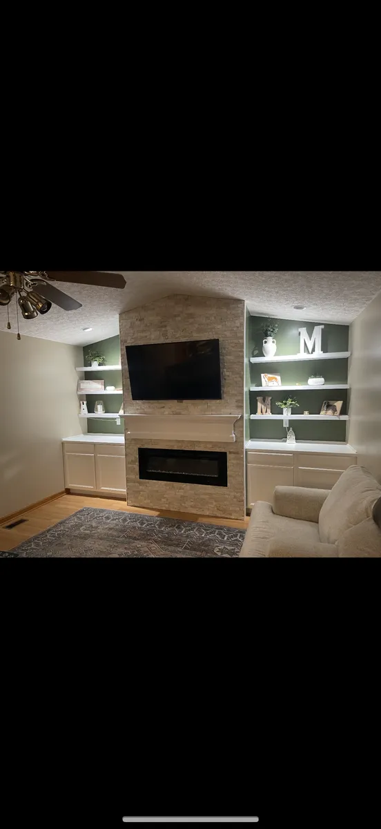 Tile Fireplace with Green Built-Ins