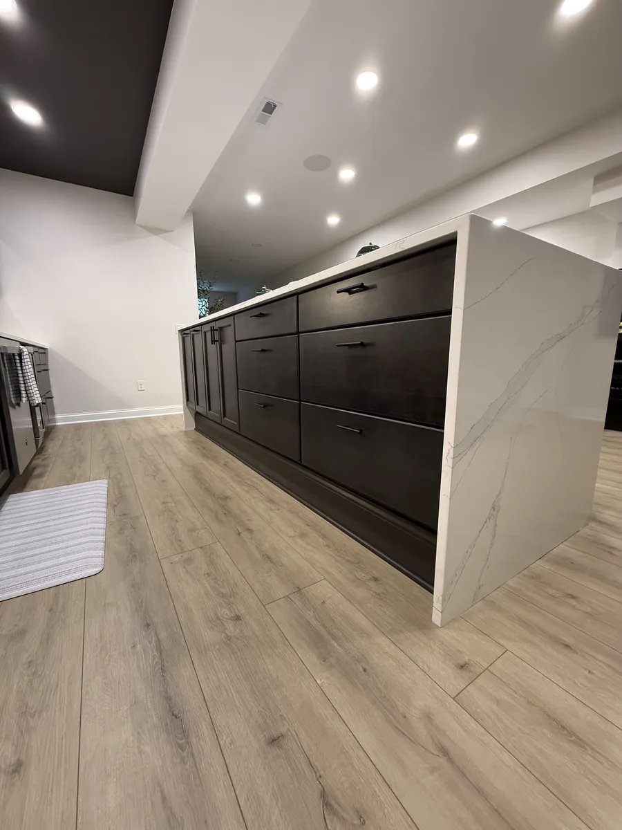 Waterfall Quartz Island with Dark Cabinets