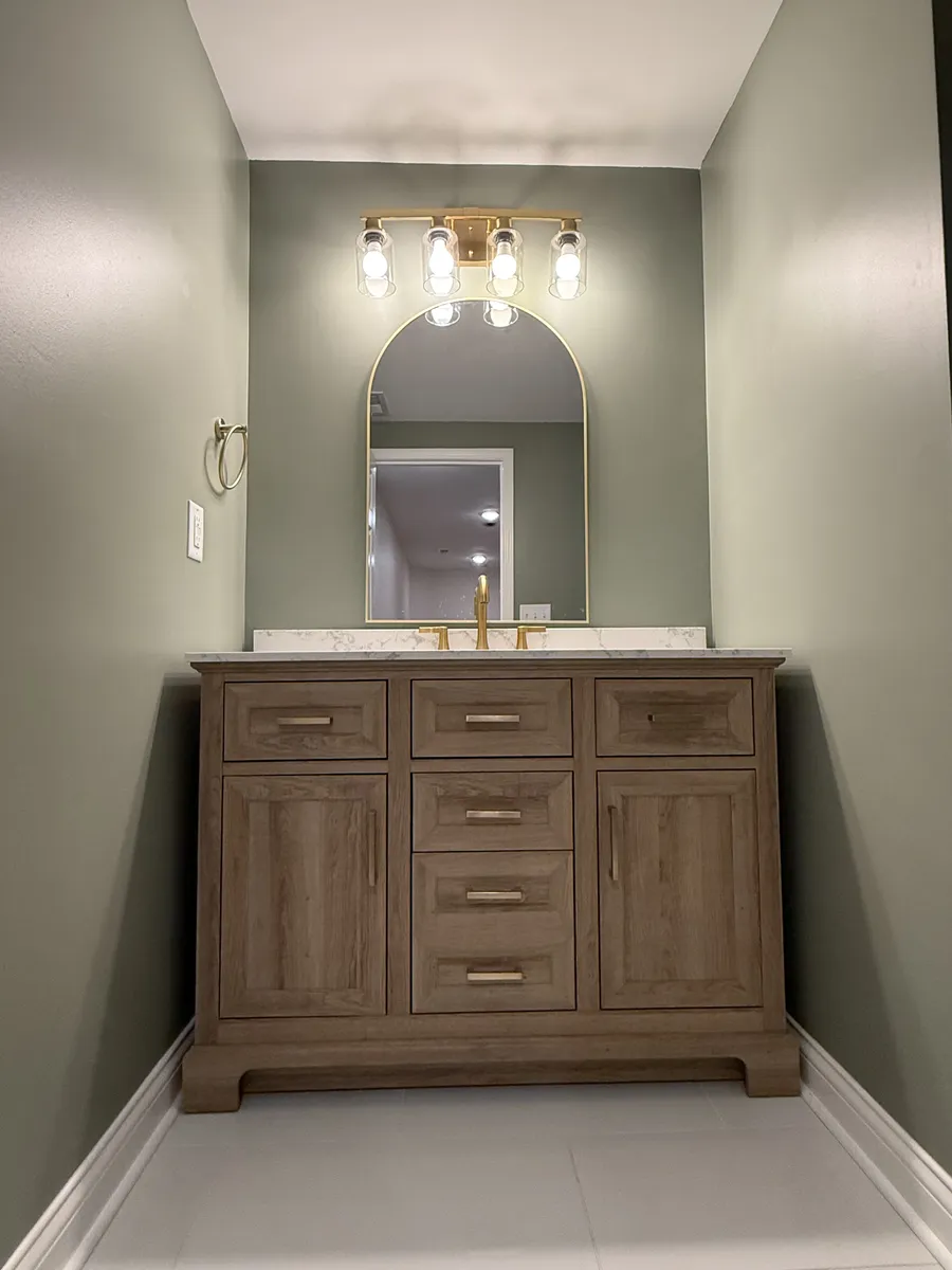 Sage Powder Room with Gold Arch Mirror